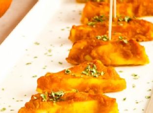 Baked paneer in pumpkin sauce