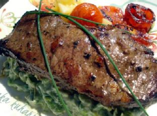 Strip steak with roasted cherry tomatoes and vegetable mash